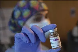  ?? ALVARO BARRIENTOS — THE ASSOCIATED PRESS FILE ?? A health worker holds a dose of the AstraZenec­a COVID-19vaccine at San Pedro Hospital in Logrono, northern Spain.