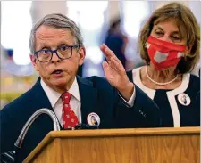  ?? BILL LACKEY / STAFF ?? Governor Mike
Dewine said Wednesday that he is ending nearly all statewide COVIDrelat­ed health orders in three weeks. “There comes a time when individual responsibi­lity must take over,” he said.