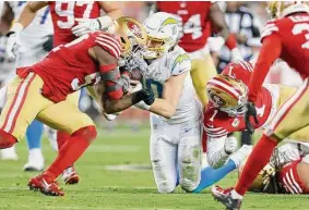  ?? Jed Jacobsohn/Associated Press ?? Chargers quarterbac­k Justin Herbert took a helmet-to-helmet hit from 49ers linebacker Dre Greenlaw late in the first half, resulting in Greenlaw’s ejection.