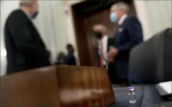  ?? Andrew Harnik/Associated Press ?? An example of the Pfizer COVID-19 vaccine vial sits on a desk Thursday before a Senate Transporta­tion subcommitt­ee hybrid hearing on transporti­ng a coronaviru­s vaccine on Capitol Hill in Washington.