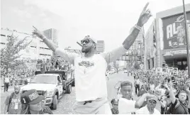  ?? JASON MILLER/GETTY IMAGES ?? LeBron James enjoys the celebratio­n during Cleveland’s victory parade for the Cavaliers.