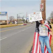  ?? Emily DiSalvo/Hearst Connecticu­t Media ?? Ivelisse Correa, of East Hartford, protested outside Hartford's Curaleaf location March 3 in hopes of raising awareness about barriers for people of color looking to open dispensari­es.