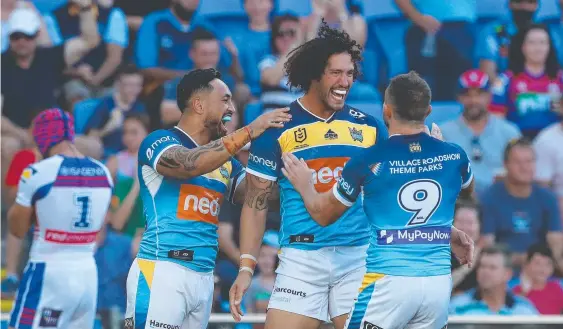  ??  ?? Kevin Proctor of the Titans celebrates a try during the Round 5 win against Newcastle. Picture: Chris Hyde/Getty Images