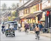  ?? Jordan Banks
Rober t Harding World I mager y/ Getty I mages ?? LUANG PRABANG, Laos, is at one end of a touristtra­veled road where there have been shootings.