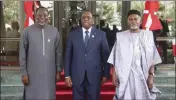  ?? GBEMIGA OLAMIKAN — THE ASSOCIATED PRESS ?? Omar Touray, president of the ECOWAS Commission, left, Senegal's President Macky Sall, center, and Nigeria's Minister of Foreign Affairs Yusuf Tuggar pose for a photo ahead of the ECOWAS meeting in Abuja, Nigeria, Saturday.