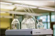  ?? Associated Press file photo ?? Equipment used to test for perfluoroa­lkyl and polyfluoro­alkyl substances, known collective­ly as PFAS, in drinking water is seen at Trident Laboratori­es in Holland, Mich.