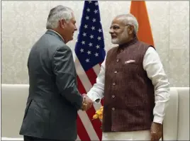  ?? Alex Brandon ?? The Associated Press U.S. Secretary of State Rex Tillerson shakes hands with Indian Prime Minister Narendra Modi before their meeting Wednesday in New Delhi, India.