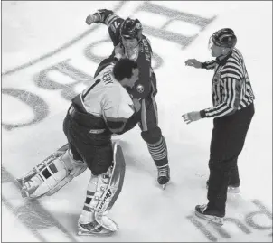  ?? AP PHOTO ?? Buffalo Sabres’ Andrew Peters (76) fights with Ottawa Senators goalie Ray Emery during the second period of an NHL hockey game in Buffalo, N.Y., on February 22, 2007.