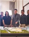  ??  ?? MEGAWORLD Senior Vice-President and Head for Lifestyle Malls Kevin Andrew L. Tan (middle) points to a scale model of the P2.2-billion Festive Walk Mall, located inside its P35billion township Iloilo Business Park.