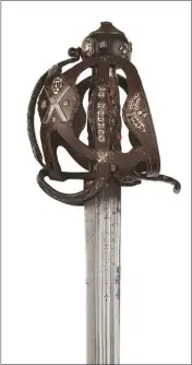  ??  ?? Above and top: this early-17th-century basket sword sold for £20,000 at Lyon &amp; Turnbull