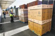  ?? Michael Macor / The Chronicle ?? Mattresses are loaded onto trucks at the Zinus warehouse in San Leandro.