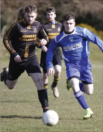  ??  ?? Carnew’s Dan Nolan and Roundwood’s David Kavanagh in action recently.