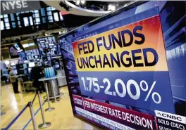  ?? RICHARD DREW / ASSOCIATED PRESS ?? A screen at the New York Stock Exchange displays the Federal Reserve’s decision Wednesday to leave interest rates unchanged. The Fed said the U.S. economy is “strong” and signaled that more rate hikes are coming.