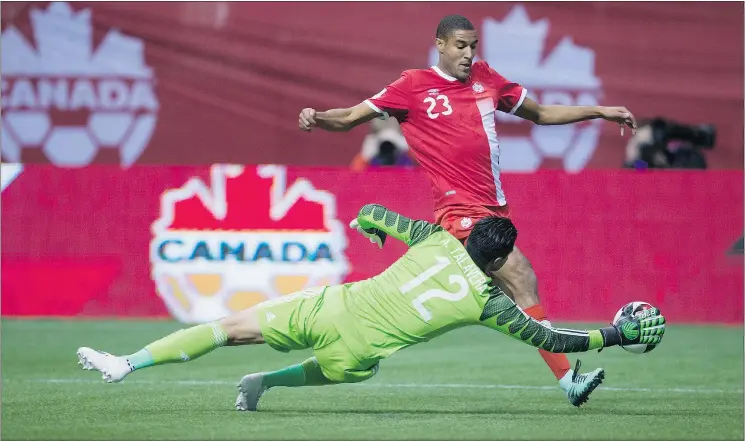  ??  ?? Canada’s Tesho Akindele is stopped by goalkeeper Alfredo Talavera during Mexico’s 3-0 win last Friday at B.C. Place. Mexico will be even tougher at home Tuesday.