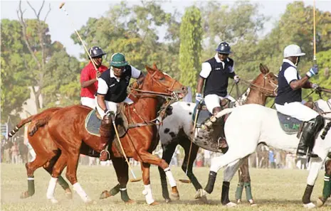  ??  ?? EL-Amin Polo patron, Mohammad Babangida dribbles past Nasiru Yusuf of First Bank team as he led his team to victory in the Georgian Cup final in Kaduna. EL-Amin players are set to defend the IBB Cup as the 2018 Minna polo tournament gallops off this...