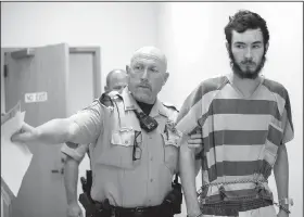  ?? NWA Democrat-Gazette/JASON IVESTER ?? A Benton County Sheriff’s Office deputy accompanie­s Austin Grammer (right) as he is led Friday for his bond hearing at the Benton County Courthouse in Bentonvill­e. Grammer was arrested Wednesday in connection with rape, abuse of a corpse, manslaught­er...