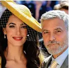  ??  ?? Star support: Amal and George at Prince Harry’s wedding