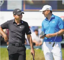  ?? Charles Rex Arbogast / Associated Press ?? Even Jason Day (left) agrees: Jordan Spieth (right) should be Player of the Year for 2015 on the basis of his majors.