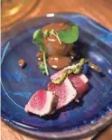  ?? MICHAEL CHOW/THE REPUBLIC ?? Charcoal seared bluefin tuna at Binkley’s Restaurant in Phoenix.