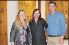  ?? (NWA Democrat-Gazette/Carin Schoppmeye­r) ?? Jeannie McIntire (from left) and Kara and Martin Smith visit at the MONAH Prairie to Table Dinner.