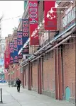  ?? STUART CAHILL / BOSTON HERALD ?? Jersey Street is empty outside Fenway Park after the Red Sox postponed Opening Day due to rain and mist on Thursday. The game will be made up today.