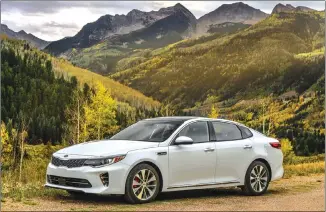  ??  ?? The 2017 Kia Optima is one of a new crop of midsize passenger cars utilizing four-cylinder engines, which weigh less than V6 engines and allow for better handling.