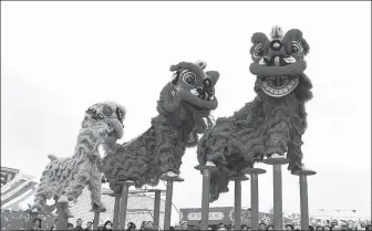  ?? SUI XIANKAI / XINHUA ?? Lion dancers perform in Yongning county, Ningxia Hui autonomous region, in February last year.