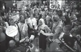  ?? GLEN STUBBE/STAR TRIBUNE ?? U.S. Rep. Ilhan Omar speaks to supporters after arriving home, at Minneapoli­s’ Saint Paul Internatio­nal Airport on Thursday in Minnesota.