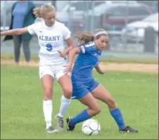  ?? STAN HUDY SHUDY@ DIGITALFIR­STMEDIA.COM @STANHUDY ON TWITTER ?? Saratoga Springs Blue Streak Julia DiMenna holds off a Albany High defender during their Suburban Council clash, Sept. 8at Saratoga Springs High School