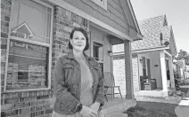  ?? PHOTOS BY CHRIS LANDSBERGE­R/THE OKLAHOMAN ?? April Heiple, Food & Shelter Inc. executive director, poses for a photo near Gene and Judy McKown Village on the grounds of Food & Shelter, 201 Reed Ave. in Norman.