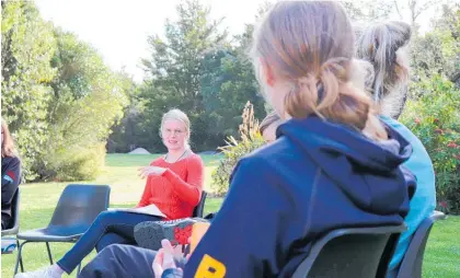  ?? Photo / Sian Moffitt ?? Climate change activist Sophie Handford, 19, meeting with Kids Greening Taupo¯ student leaders at Waipa¯hı¯hı¯ Botanical Reserve.