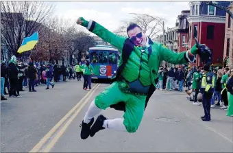  ?? ?? Owen Howell of Nashville jumps in the air during his visit to Boston for the parade.