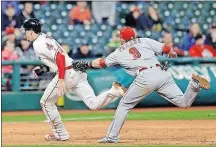  ?? [TONY DEJAK/THE ASSOCIATED PRESS] ?? The Reds’ Jose Peraza tags out the Indians’ Bradley Zimmer on an attempt to steal to third base in the sixth inning.