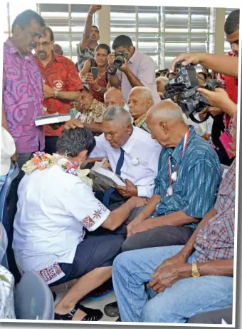  ?? Photo: Shratika Naidu ?? Acting Prime Minister and Attorney-General Aiyaz Sayed-Khaiyum being blessed by Ram Pratap Singh, 85, while Minister for Local Government, Housing and Environmen­t, Infrastruc­ture and Transport Parveen Bala (left, standing), and other guests look on.