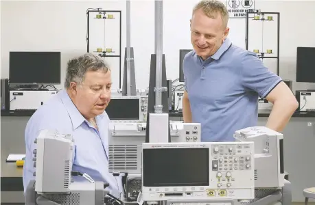  ?? DAN JANISSE ?? University of Windsor's director of the Centre for Automotive Research Peter Frise, left, and dean of the faculty of engineerin­g Bill Van Heyst at work in a lab at the school on Tuesday. Frise says Stellantis's investment in a battery lab will only deepen its relationsh­ip with the university.