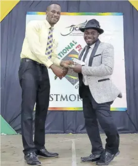  ?? ?? Gabre Samuels collects a gold award at the recently concluded JCDC Westmorela­nd Parish Finals.