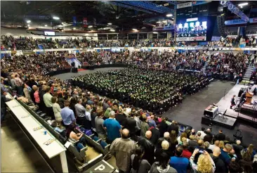  ?? Herald photo by Ian Martens ?? Graduands and family and friends fill the arena for Lethbridge College’s spring convocatio­n ceremony Friday, one of the many events in recent days that has been keeping staff busy at the Enmax Centre. @IMartensHe­rald