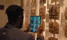  ?? Keleenna Onyeaka ?? Chidi Nwaubani scanning the Benin brass plaques at the British Museum. Photograph: