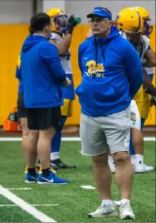  ?? Lucy Schaly/Post-Gazette ?? Pitt coach Pat Narduzzi watches Wednesday’s practice inside the UPMC Rooney Sports Complex on the South Side.