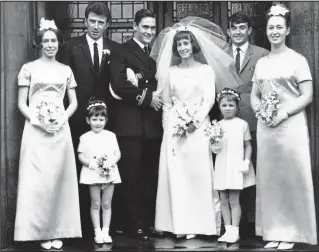  ??  ?? Bride on a budget: Norma and Iain Smith and their wedding party in 1966