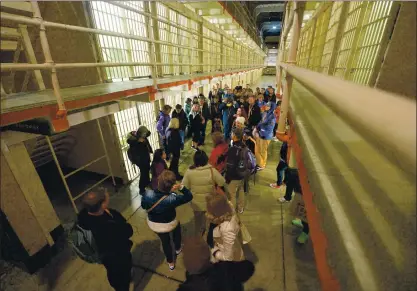  ?? DOUG DURAN — STAFF ARCHIVES ?? People attend a tour in the cell area during an Alcatraz tour on Alcatraz Island on March 31, 2016. The landmark park opens next week.