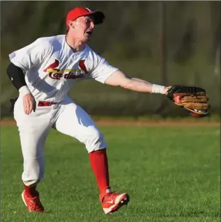  ??  ?? Hamilton Cardinals right-fielder Connor Bowie stretches to snag a fly ball during Tuesday’s 9-4 loss to the Burlington Herd.
