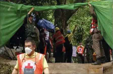  ?? CHIANG RAI PUBLIC RELATIONS OFFICE VIA AP ?? In this grab taken from video provide by Chiang Rai Public Relations Office, emergency workers carry a stretcher with one of the rescued boys to be transporte­d by ambulance to a hospital Sunday in Mae Sai in the district of Chiang Rai, Thailand. Expert divers Sunday rescued four of 12 boys from a flooded cave in northern Thailand where they were trapped with their soccer coach for more than two weeks.