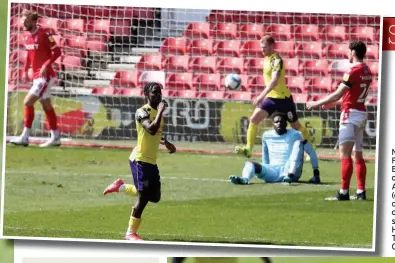 ??  ?? Nottingham Forest keeper Brice Samba is on the floor as Aaron Rowe (centre) celebrates opening the scoring for Huddersfie­ld Town at the City Ground