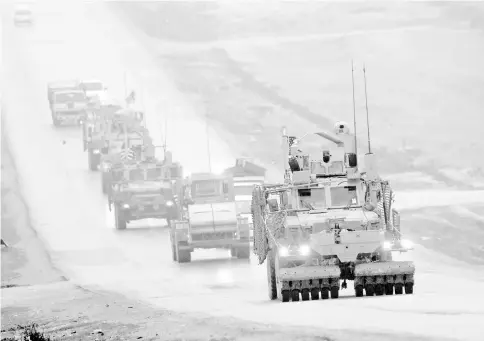  ??  ?? File photo shows a convoy of US military vehicles in Syria’s northern city of Manbij. — AFP photo