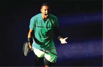  ?? CLIVE BRUNSKILL/GETTY IMAGES/AFP ?? Nick Kyrgios shows his emotion after a point during his victory against Novak Djokovic in their fourth-round match at Indian Wells Tennis Garden on Wednesday in California.