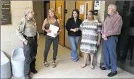  ?? The Sentinel-Record/Richard Rasmussen ?? VOLUNTEERS: From left, Garland County Sheriff’s Department Sgt. Sharon Branstette­r talks with Hot Springs School District teacher Lori Butler, Mosaic Madness Director Alice Franke, HSSD teacher Adriane Hines and Mosaic Madness volunteer Bruce Mitchell, all of whom assisted inmates at the Garland County Juvenile Detention Center in creating mosaics.