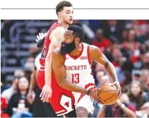  ?? KAMIL KRZACZYNSK­I-USA TODAY SPORTS ?? HOUSTON ROCKETS guard James Harden (13) looks to pass against Chicago Bulls guard Zach LaVine during the first half at United Center.