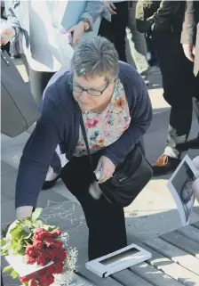  ??  ?? Floral tributes were left in Keel Square.