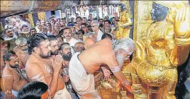  ?? PTI ?? Melsanthi Unnikrishn­an Nampoothir­i opens the Lord Ayyappa temple for the fiveday monthly pooja in the Malayalam month of 'Thulam', in Sabarimala, Kerala on Wednesday.